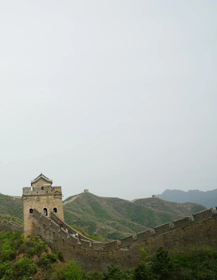 The Great Wall of China stretching across misty mountains